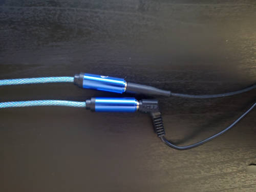 Splitter with two headphones plugged in